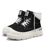 Black high-top sneakers with white laces and thick white sole, folded white cuff at the ankle.