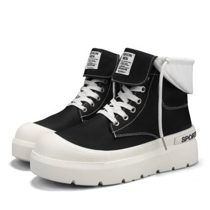 Black high-top sneakers with white laces and thick white sole, folded white cuff at the ankle.